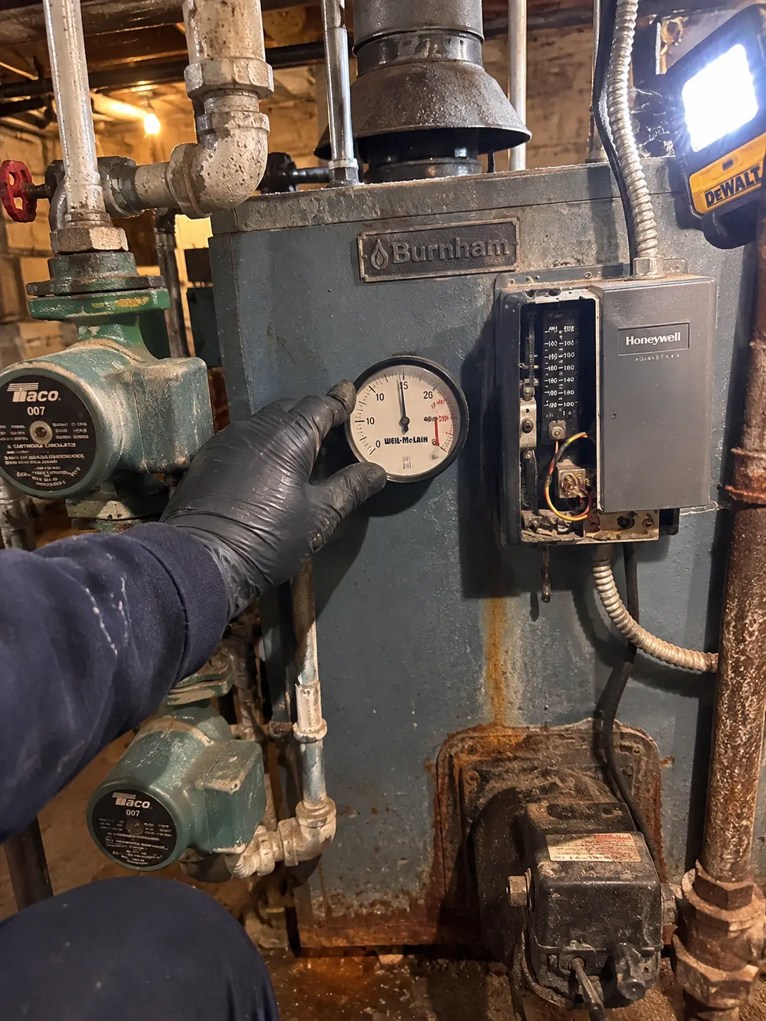 technician diagnosing a gas water heater